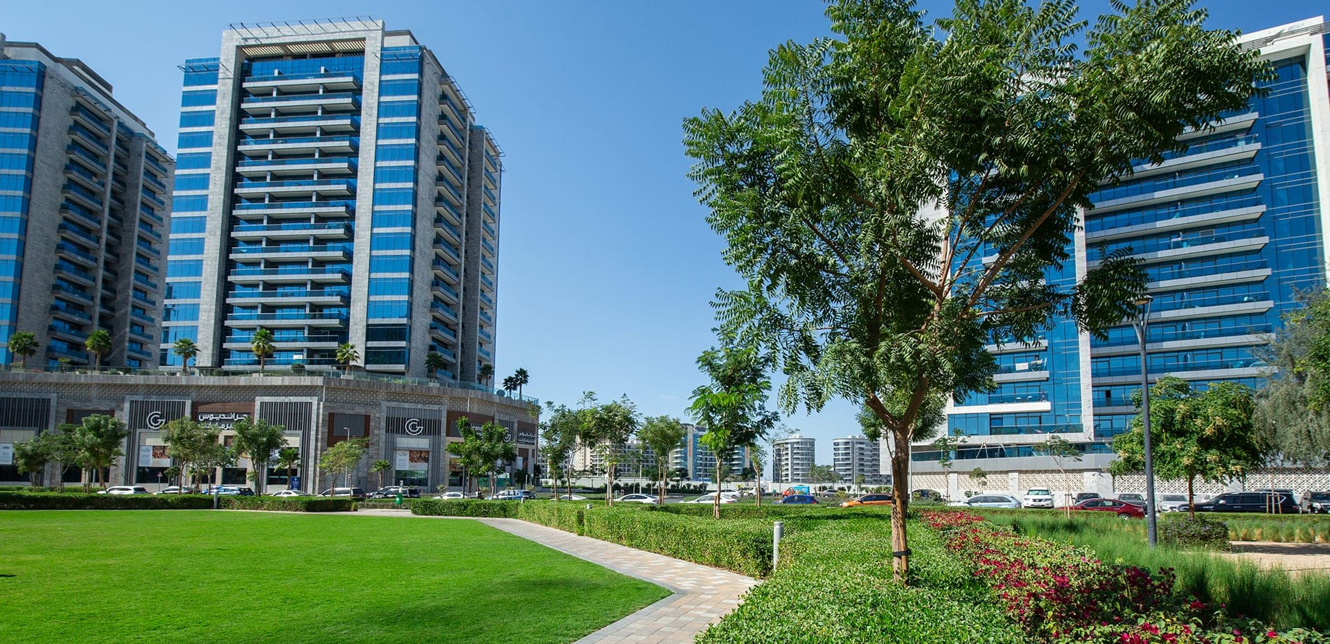 Arjan — Dubailand mid-rise apartment district beside Miracle Garden, still filling in