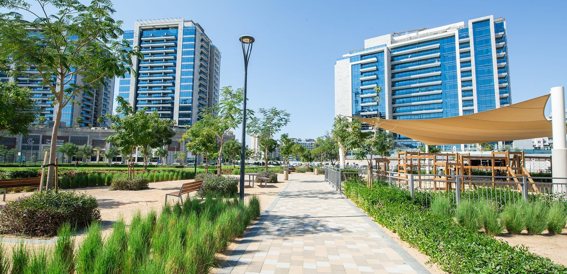 Arjan — Dubailand mid-rise apartment district beside Miracle Garden, still filling in