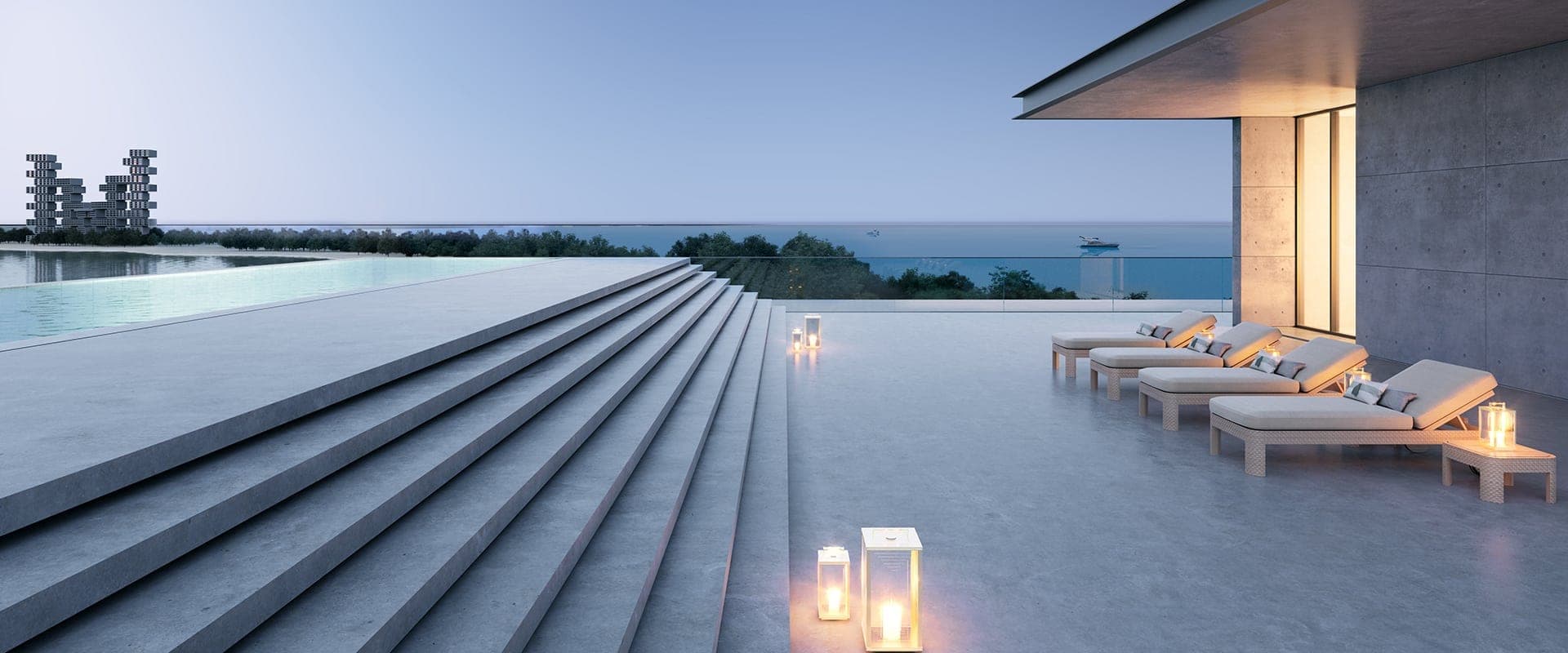 Render of a terrace at Armani Beach Residences at Palm Jumeirah at dusk, broad stone steps and loungers beside an infinity pool facing the sea, with Atlantis The Royal in the distance