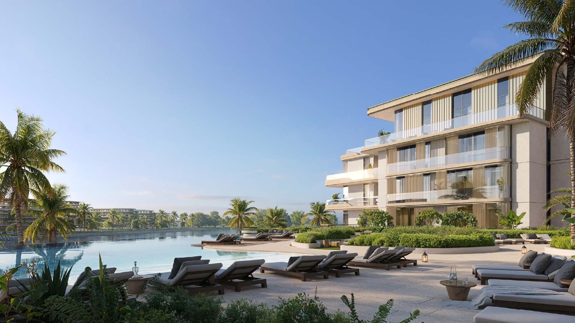 Render of a pool deck with sun loungers beside a low-rise building at Bay Grove Residences