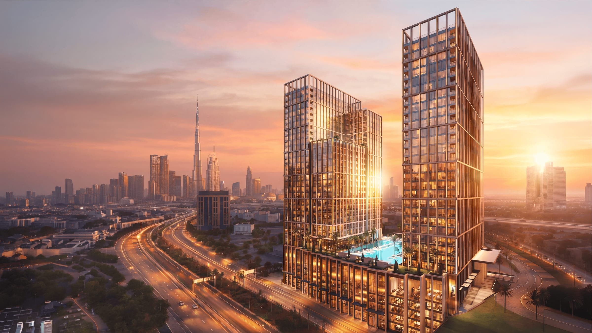 Render of Binghatti Spectre viewed from the air at sunset, the towers rising above the surrounding road network