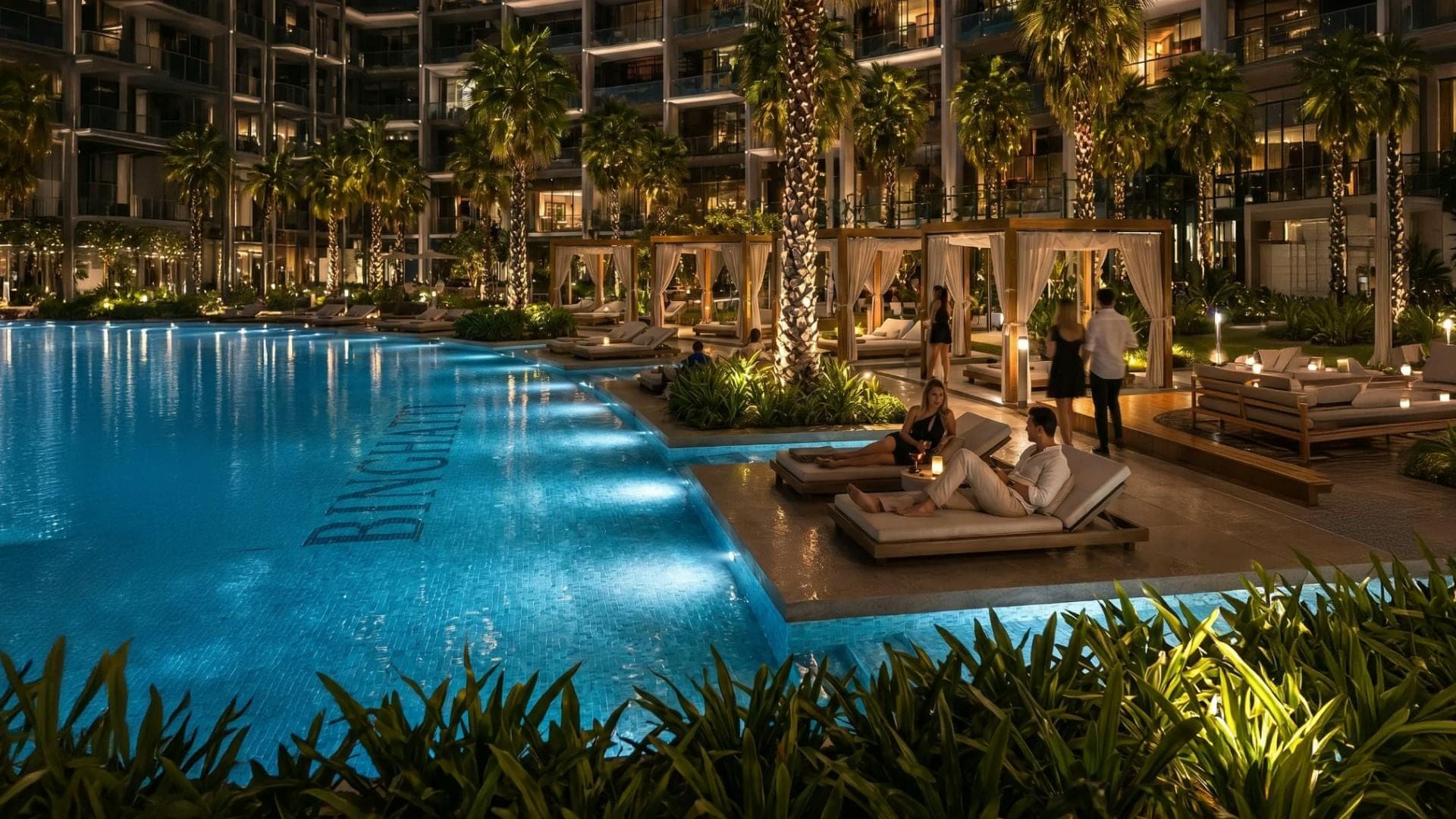 Render of the pool deck at Binghatti Wraith at night, with cabanas and loungers around the water