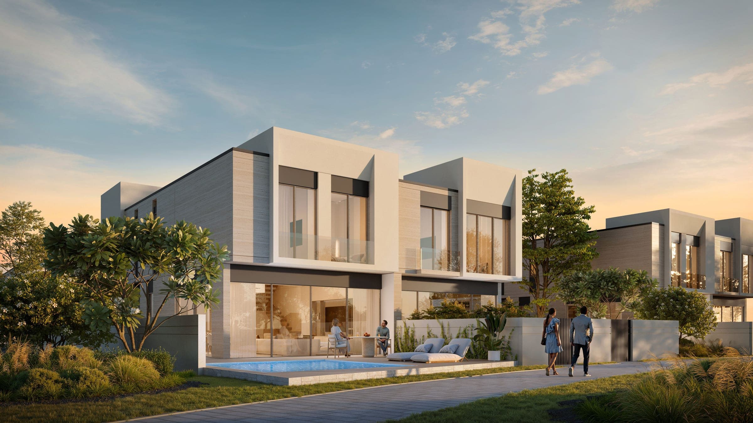 Render of D-Villas at Jumeirah Golf Estates at golden hour, two-storey villas with a garden pool beside a landscaped footpath