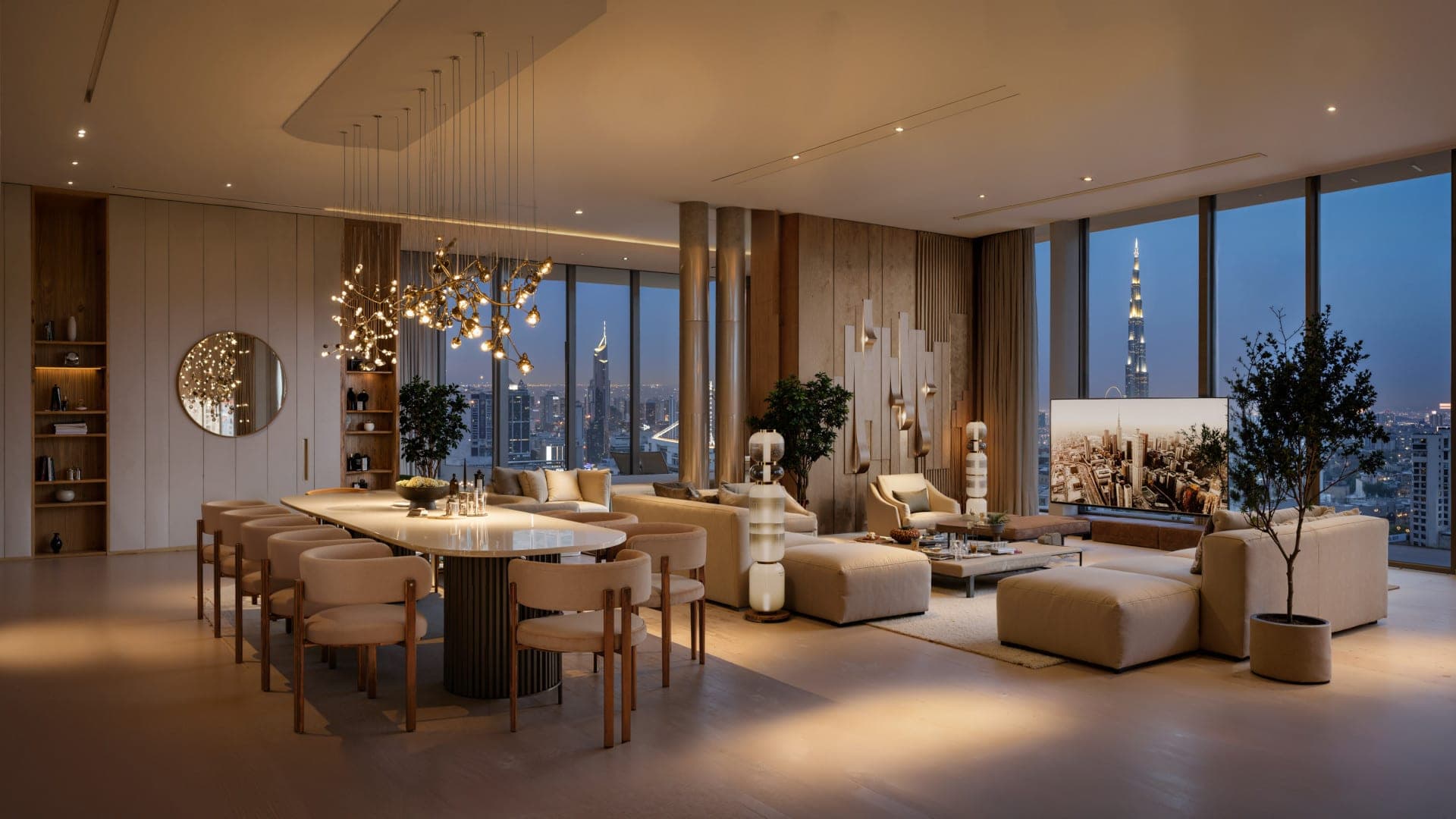 Render of a living and dining room at DWTN Residences in the evening, with a long dining table and city lights through the windows