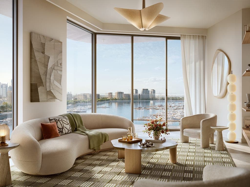 Render of a furnished living room at Fior 1 at Rashid Yachts & Marina, with marina views through full-height glazing