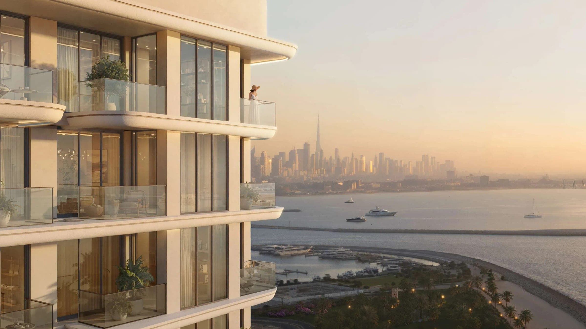 Render of the curved balconies at FLU1D ONE at sunset, looking across a marina and the sea towards the Dubai skyline