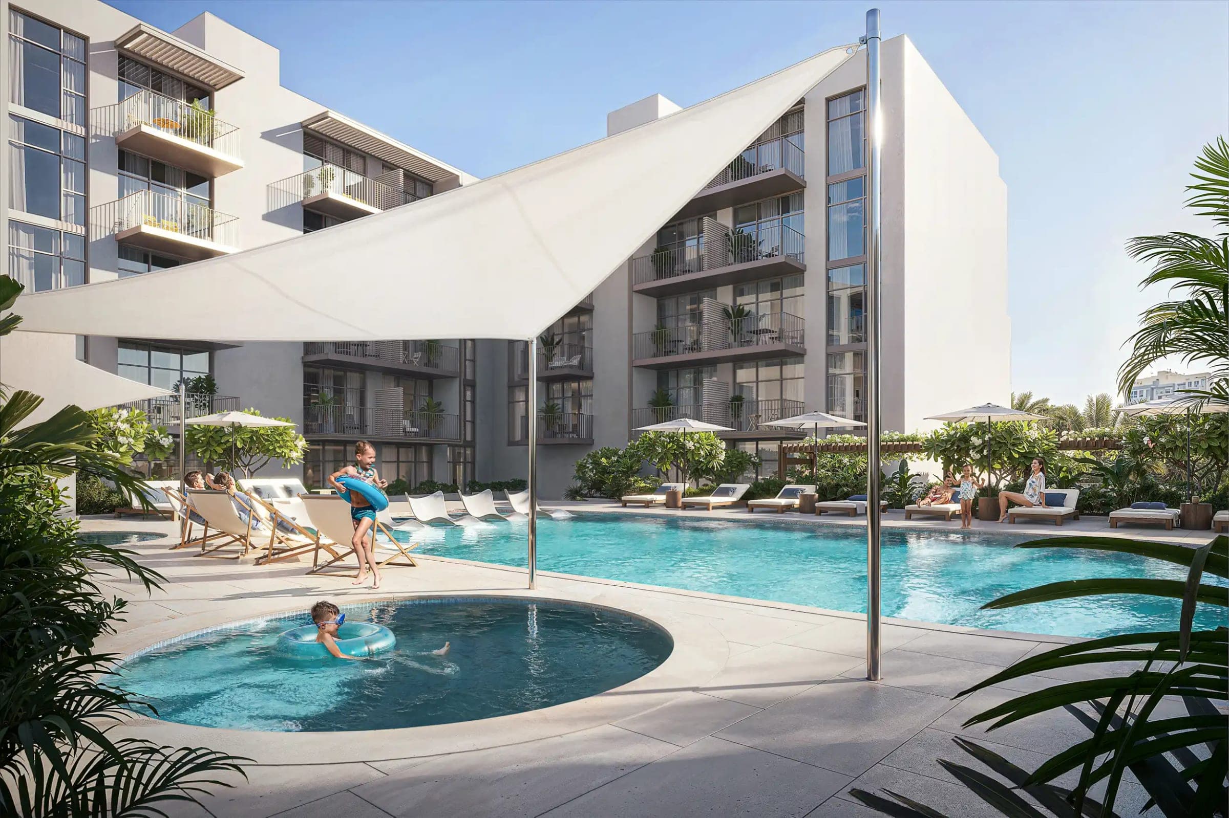 Render of the pool at IR1DIAN Park, with a shade sail over a children's pool and loungers set between the residential blocks