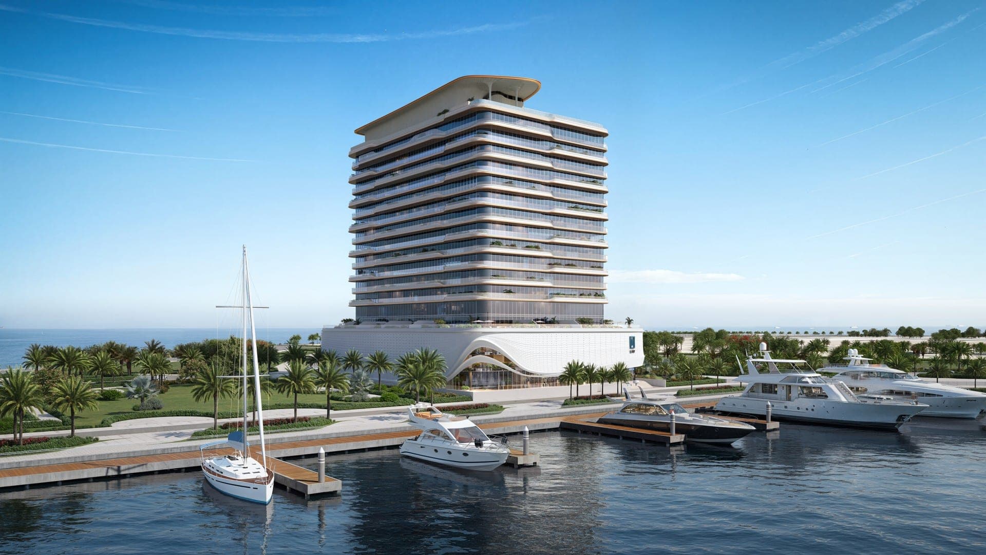 Render of LIV Oceanside on Dubai Islands from the marina, the terraced tower and white wave-patterned podium behind boats at the quay