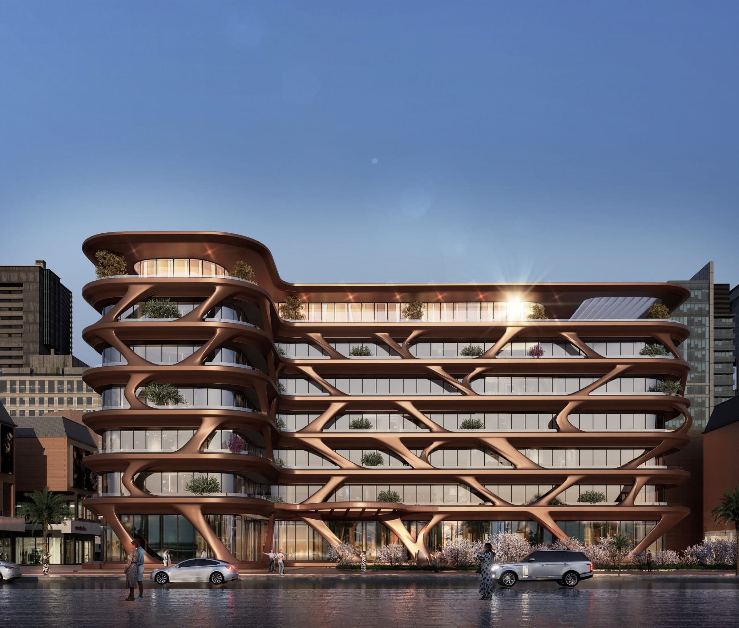 Render of the front elevation of Magnolia by Palladium at twilight, showing bronze-coloured curved balconies with planters, a rounded corner block and blossom trees along the glazed ground floor