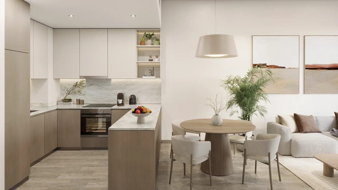 Render of a furnished kitchen and dining area in an apartment at Nirvana Residences I