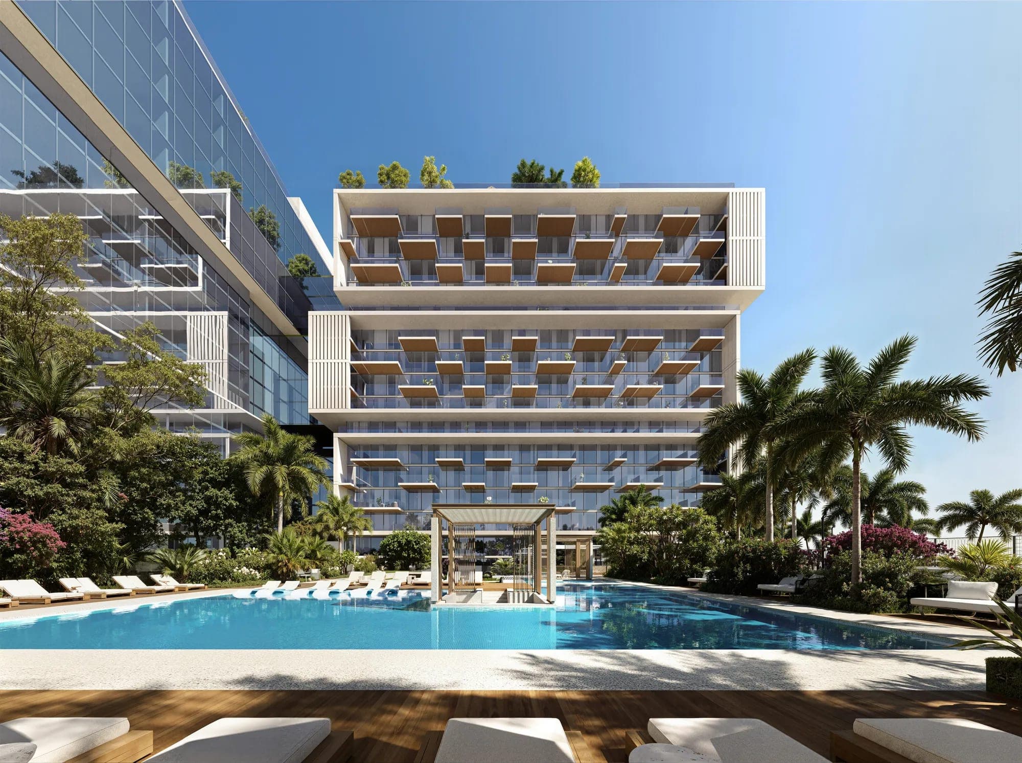 Render of the pool and deck beside the residential blocks at Raw District II by Imtiaz