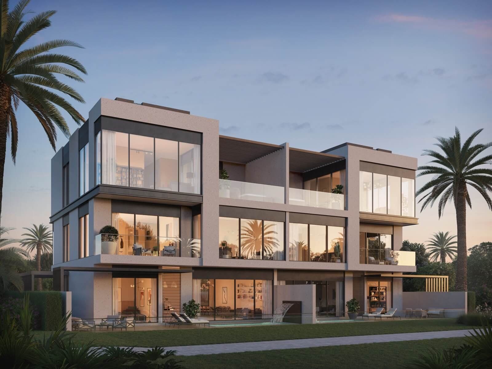 Render of a pair of twin villas at Terra Golf Collection in Jumeirah Golf Estates from the rear lawn at dusk, lit rooms behind glazed terraces