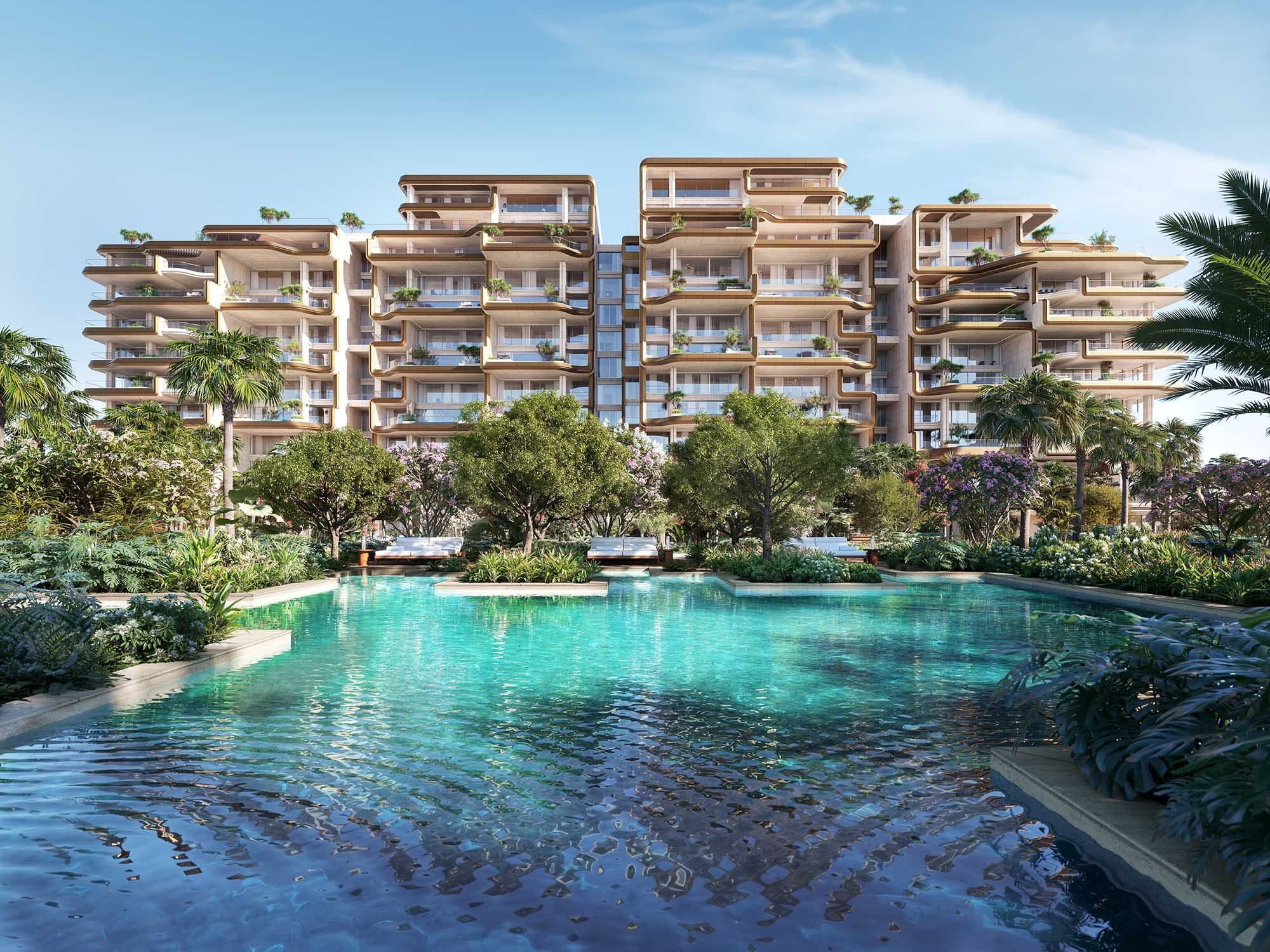 Render of the landscaped lagoon pool at The Alba Residences, with the terraced building rising behind the gardens