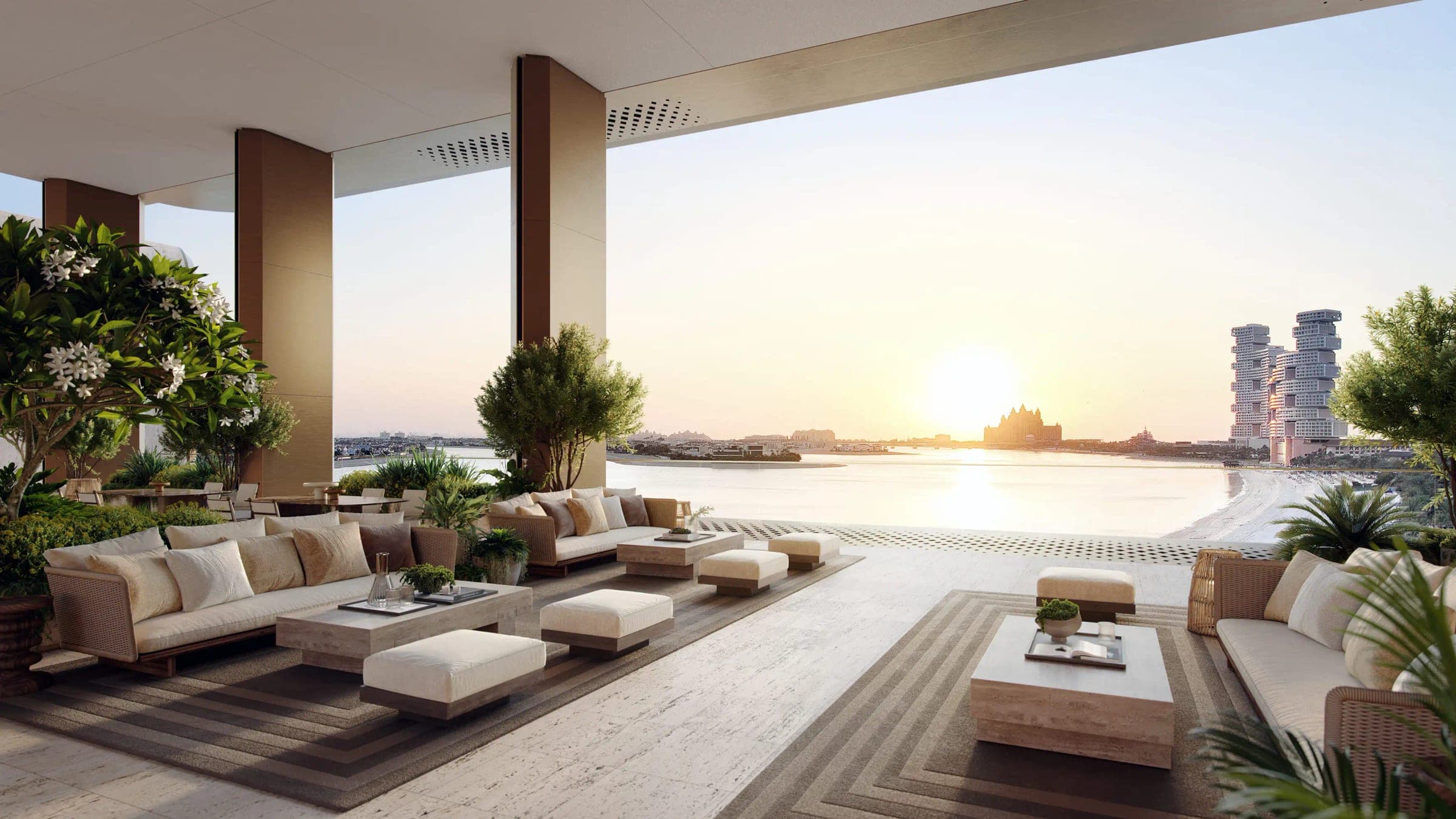 Render of the Sunset Lounge at The Alba Resort Residences, sofas under a covered terrace facing the sea, with Atlantis The Palm and Atlantis The Royal across the water at sunset