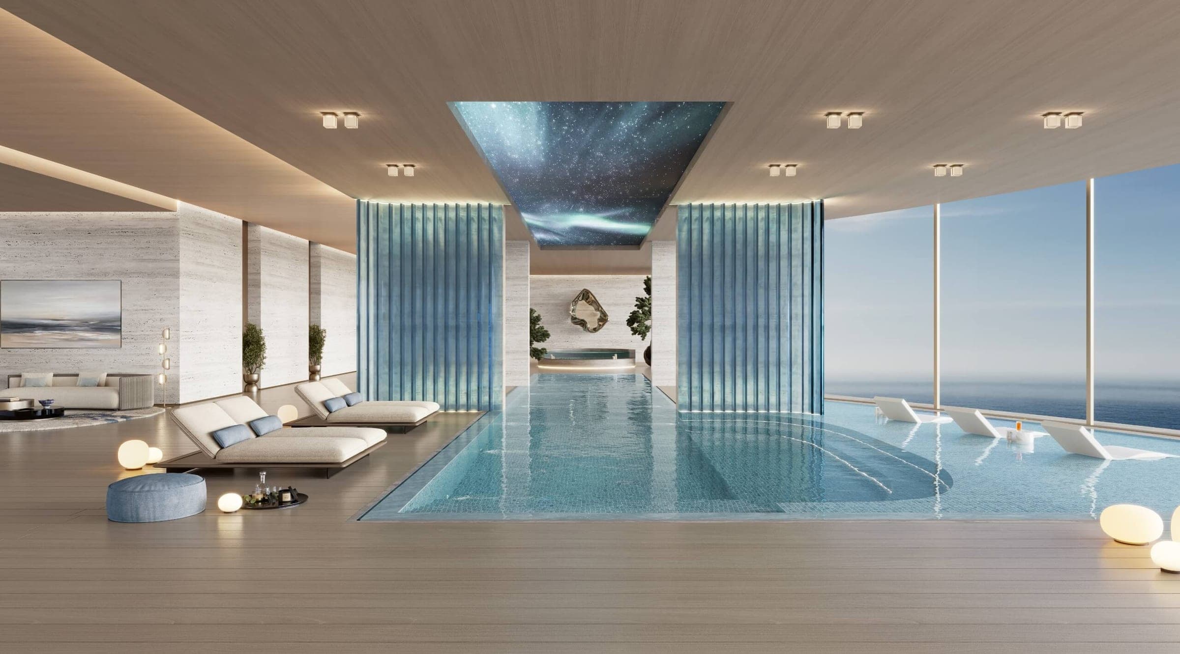 Render of an indoor pool at The Meriva Collection on Dubai Islands, with loungers, blue glass screens and floor-to-ceiling windows onto the sea