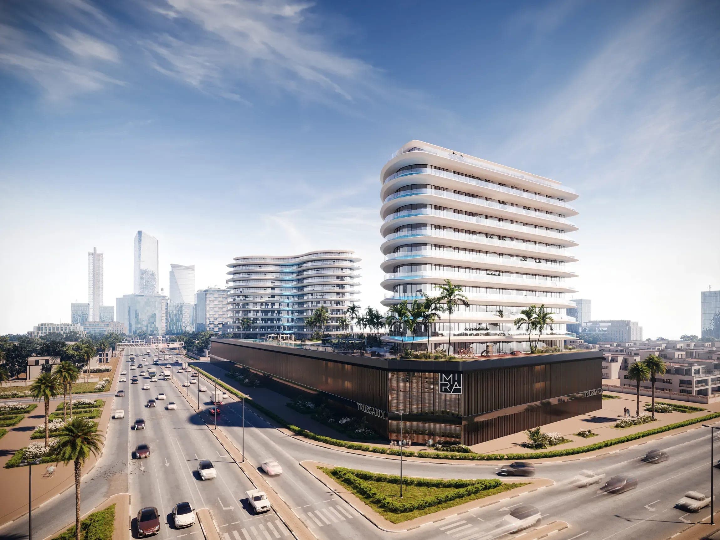 Render of Trussardi Residences Phase II from above, the building and its podium beside the boulevard with the skyline behind