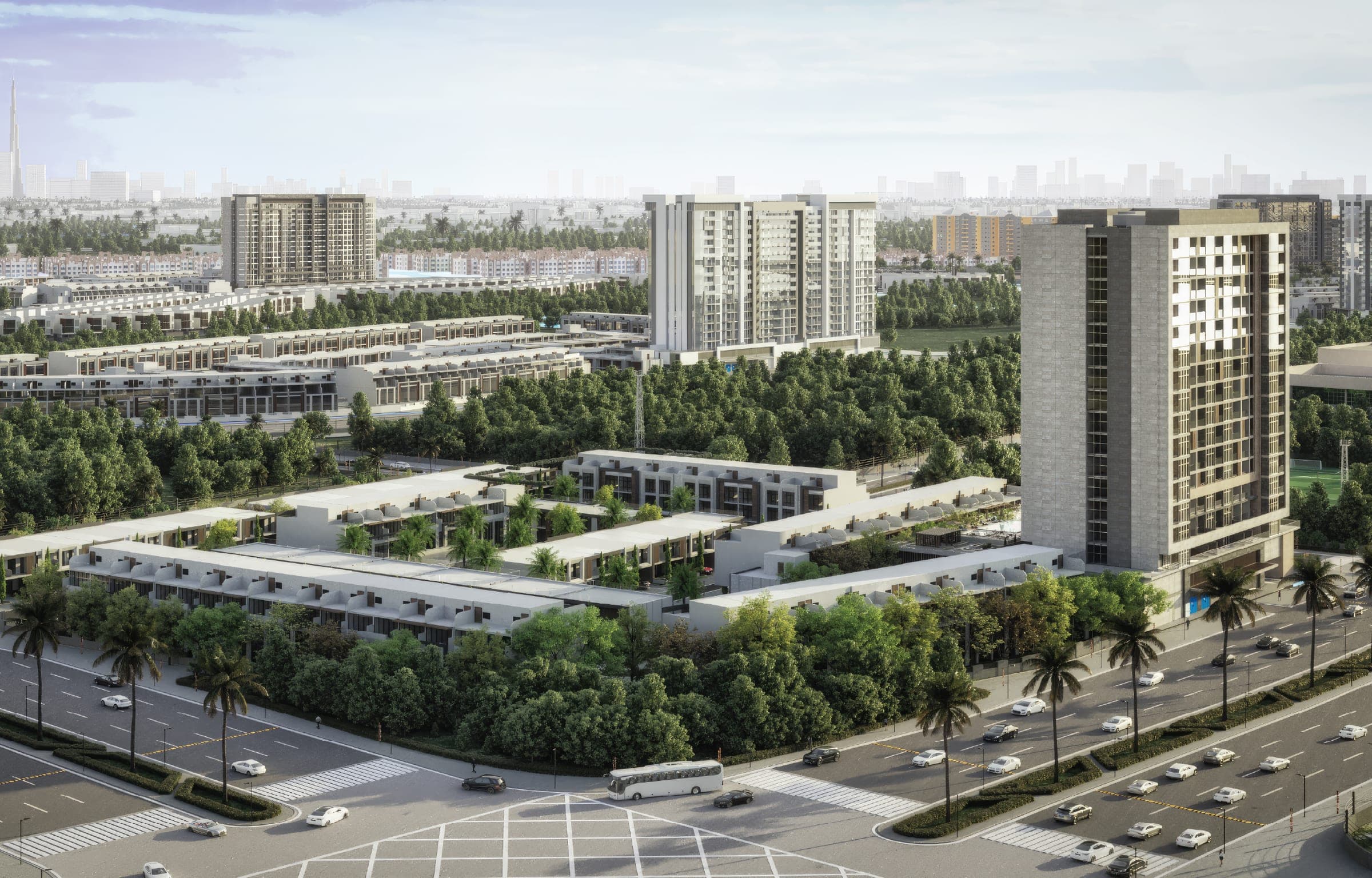 Render of Verdana, an aerial view across the community's apartment tower and townhouse terraces beside the highway in Dubai Investments Park