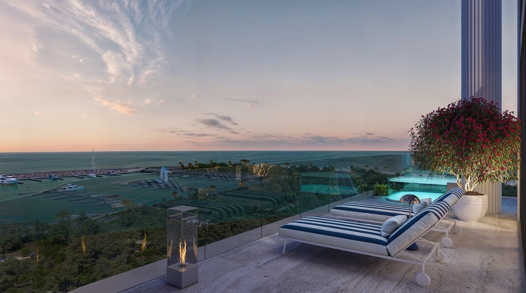 Render of an apartment terrace at Villa dell'Arte on Dubai Islands at dusk, striped loungers and a glass plunge pool looking over a marina and the sea