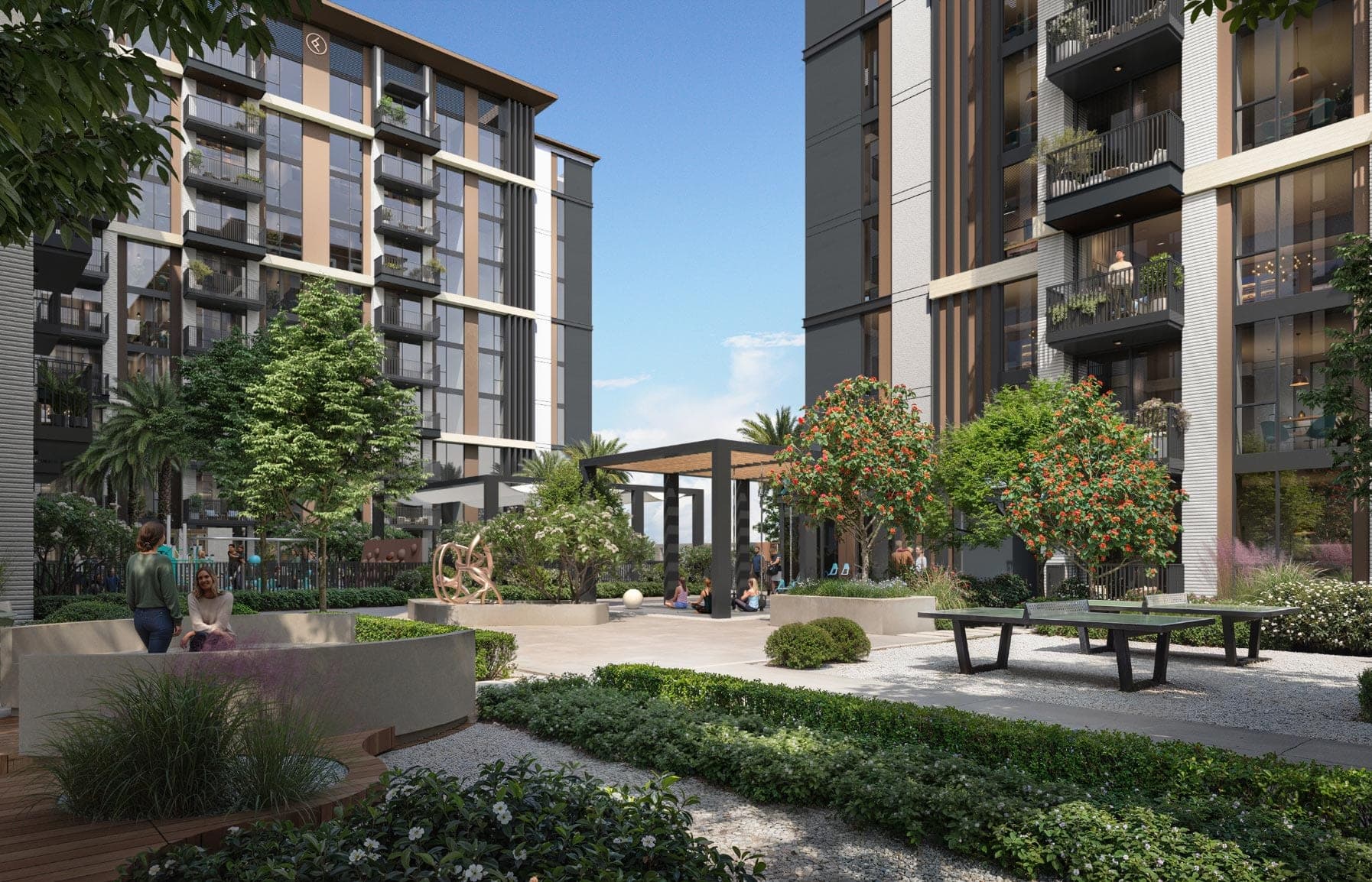Render of the landscaped courtyard at Windsor House II in Dubai South, with a pergola, table tennis tables and flowering trees between the buildings